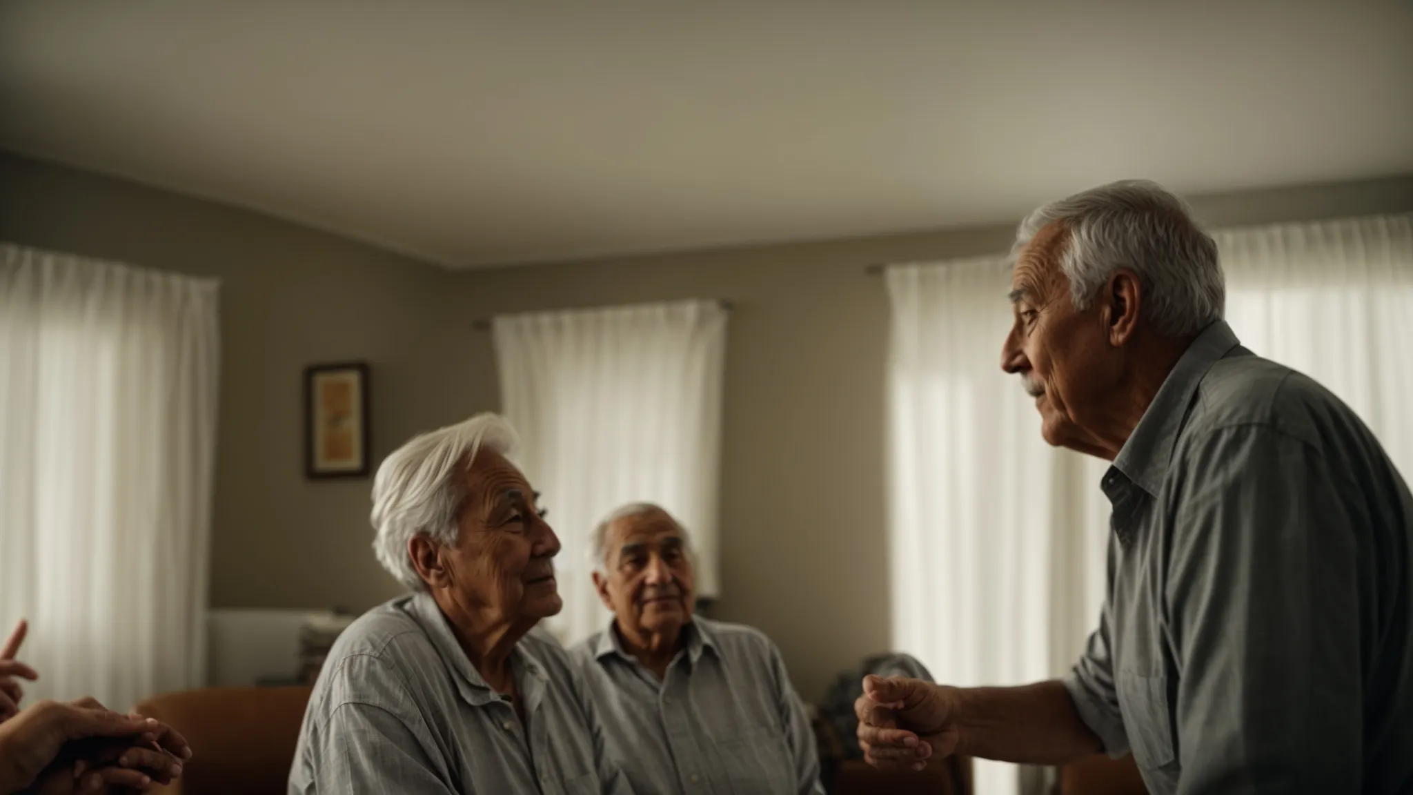 an elderly couple discussing with a contractor in their living room, pointing towards the ceiling.